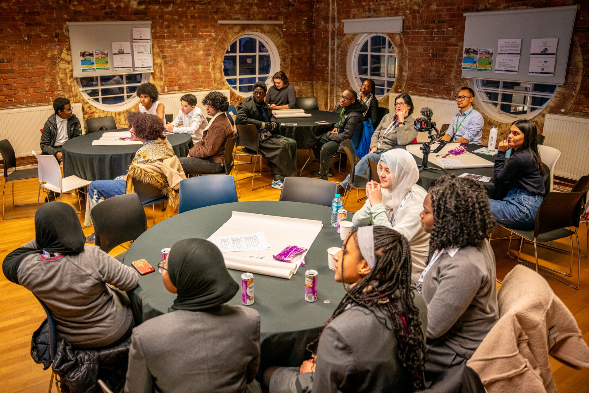 Young people at an Islington community workshop discussing local climate action